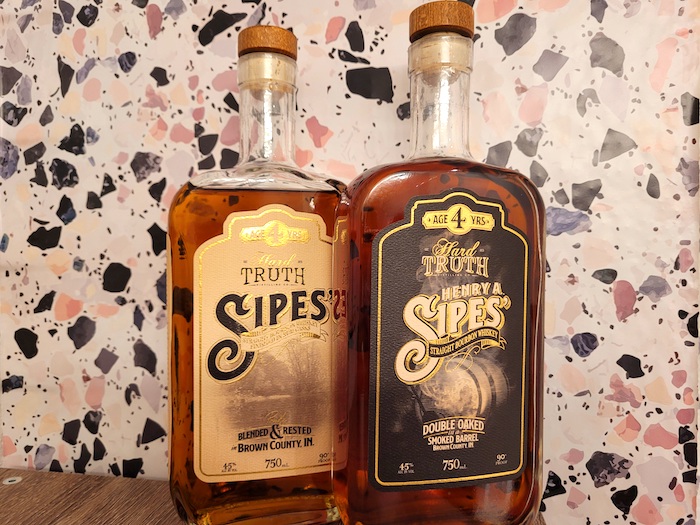 Hard Truth Henry A. Sipes' bourbon bottles.