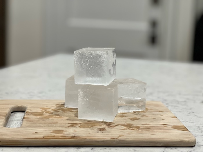 https://thewhiskeywash.com/wp-content/uploads/2021/12/Ice-made-with-the-True-Cubes-Tray-image-via-Talia-Gragg.jpeg